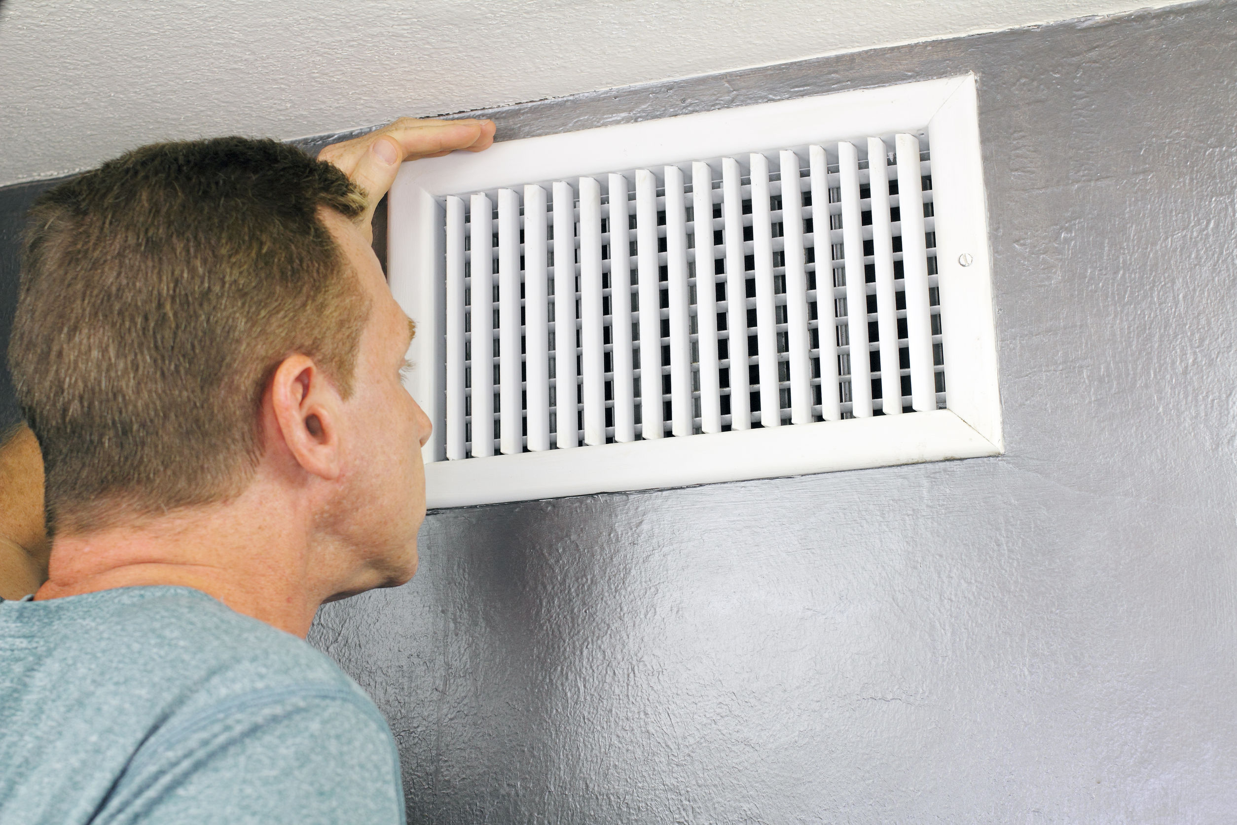 homeowner looking in vent